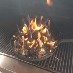 Wood embers ignite garlic