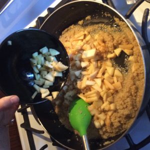 quinoa, butter and Apples in a skillet
