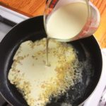 Pouring the cream for the sauce