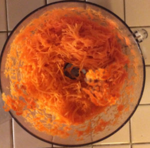 shredding carrots in the food processor makes it easy! Just don't overdue the process; need some pulp to the carrots