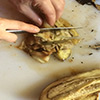 removing any char from the fire and then chopping up the eggplant to be added as the tart filling