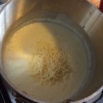 Our creamy bechamel sauce is being made in a pot on the stove top 