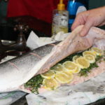 The inside of the Salmon waThe Salmon was stuffed with fresh Thyme, lemon slices and seasoned with a pinch of salt pepper and a drizzle of extra virgin olive oil s stuffed Fresh Thyme and lemon slices 