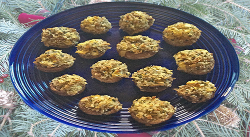 Stuffed Mushroom appetizer featuring smoked artichoke heart cooked on the plancha-stove top.
