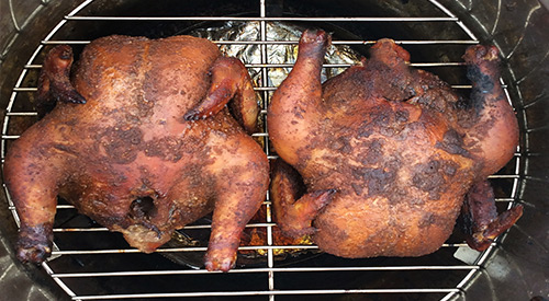 CORNISH GAME HEN MEETS SMOKE IN THE ORION COOKER and turns very golden brown