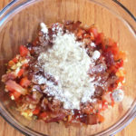 our ingredients in the mixing bowl with cheese added