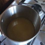 the pot of simple syrup ingredients blending over low temperatures