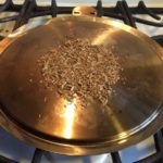 Adding wood chips to the plancha 