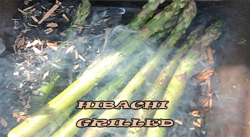 The first step for ember roasting fresh asparagus on a Hibachi!