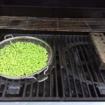 on peas on the cold side of the grill with the flame under our smoker box providing the smokey flavor 