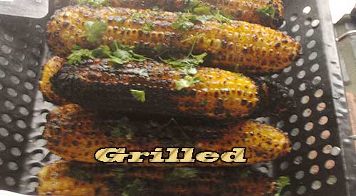 Wood flavoured grilled Corn on the Cob Topped with Fresh Parsley
