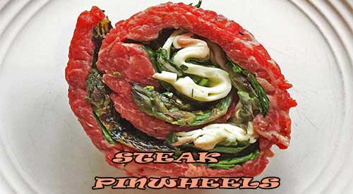 Flank steak pinwheels- with asparagus as the lead, all ingredients are mixed with the flank steak wrapped and tied for grilling.