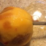 Skinning our freshly harvested peaches 