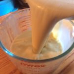 Measuring out the cream for the recipe