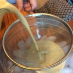 Straining the mixture 
